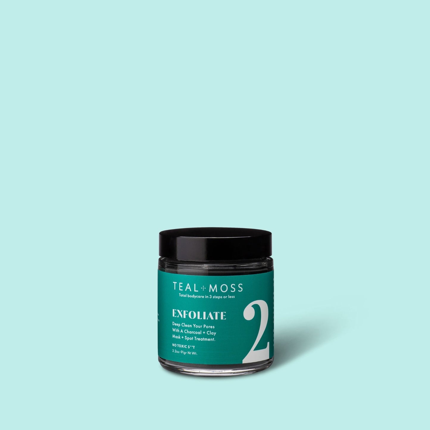 Teal and Moss mask + spot treatment 4 oz jar on a blue background